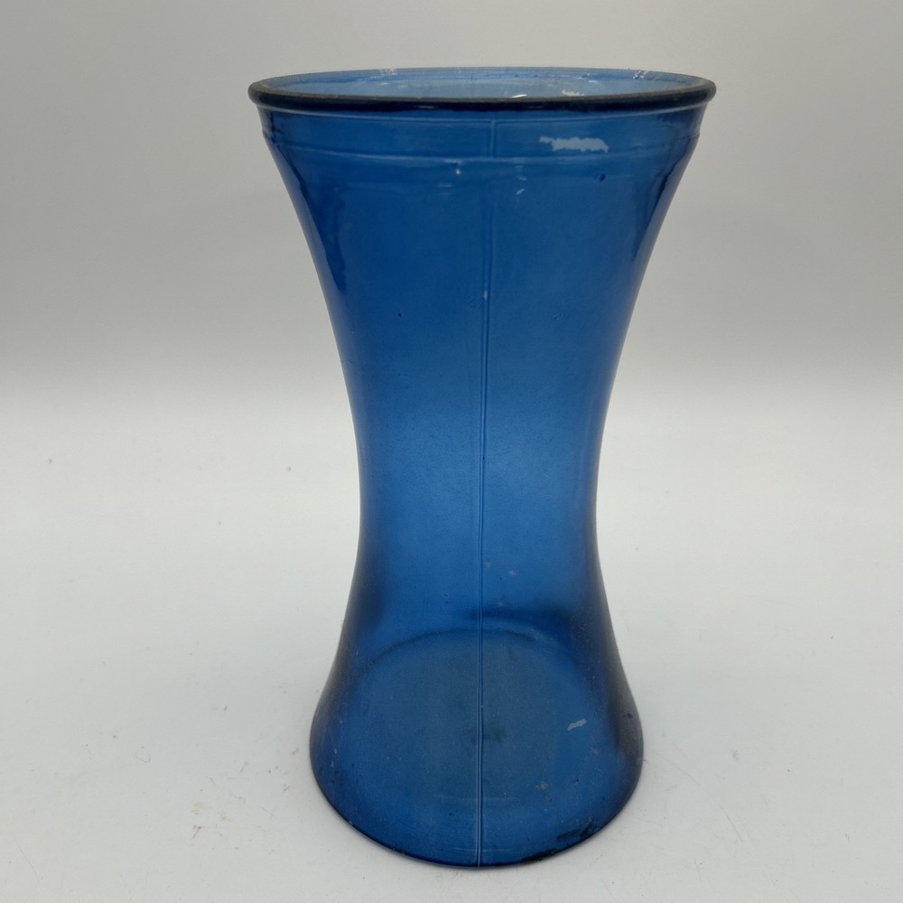 blue glass floral vase featuring a BloomNet logo printed on the base